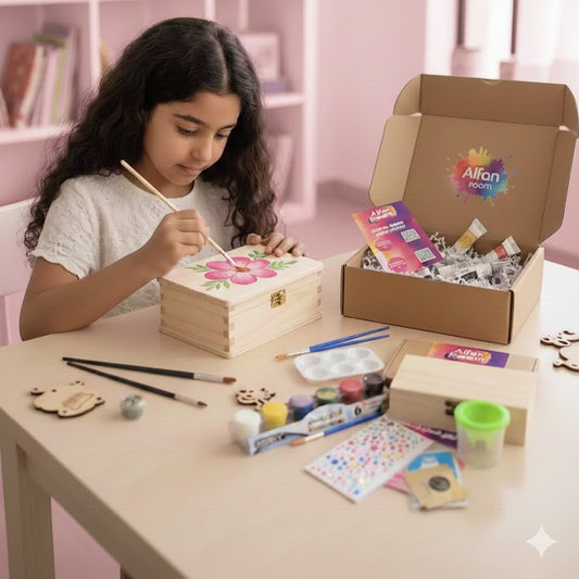 Girl painting a wooden box with art supplies on a table, Alfie Zoom box in the background.